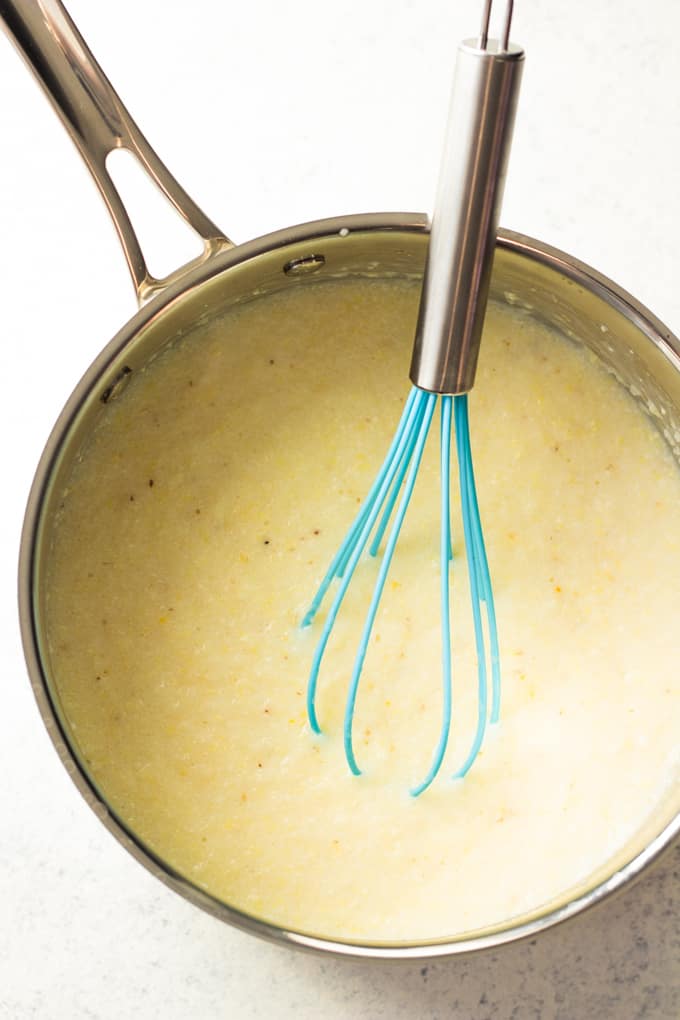 Saucepan filled with creamy grits.