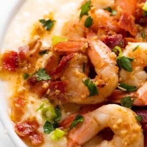 Savory shrimp and bacon loaded on top of cheesy grits in this easy to make shrimp and grits recipe.