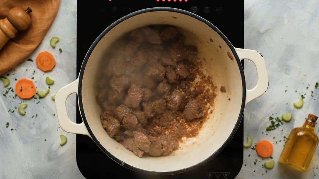 Seared beef in a dutch oven for beef stew. 