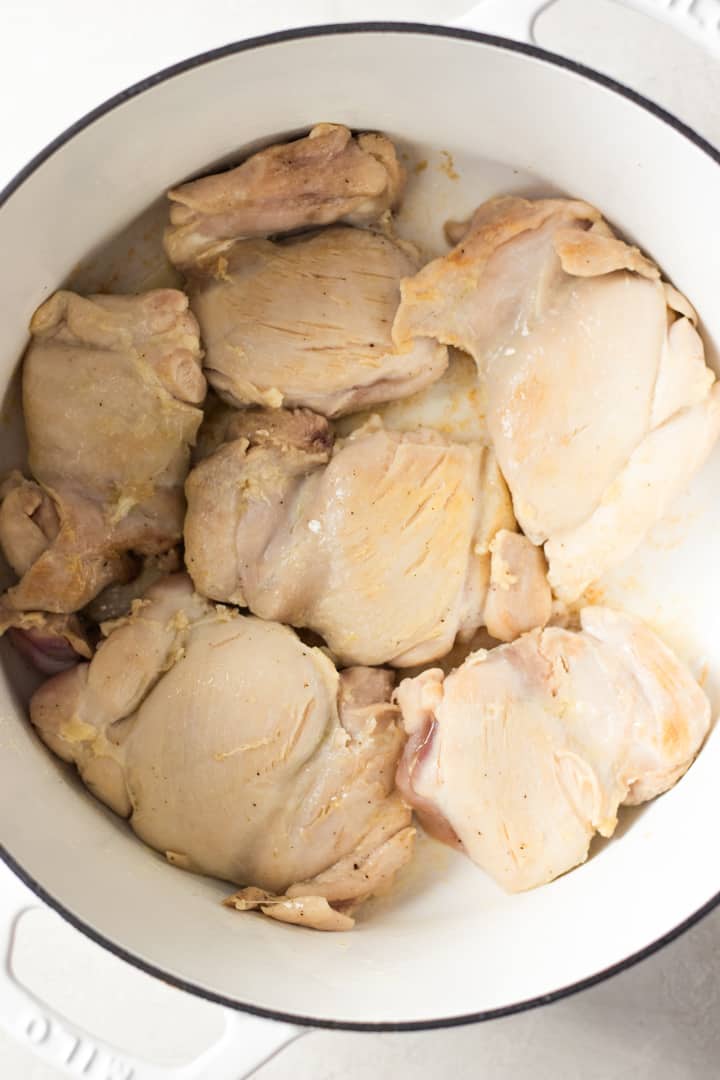Seared chicken in a dutch oven to make homemade chicken and dumplings.