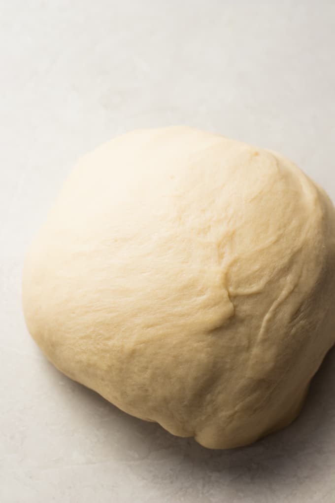 A large ball of flour tortilla dough ready to be divided.