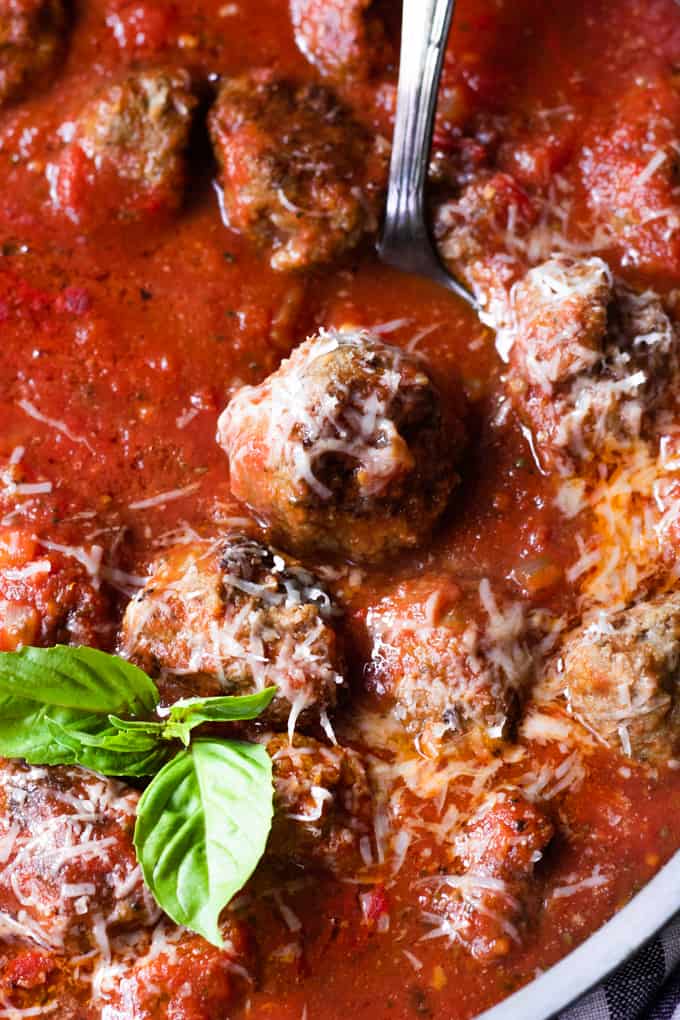 Skillet filled with homemade meatballs in marinara sauce.