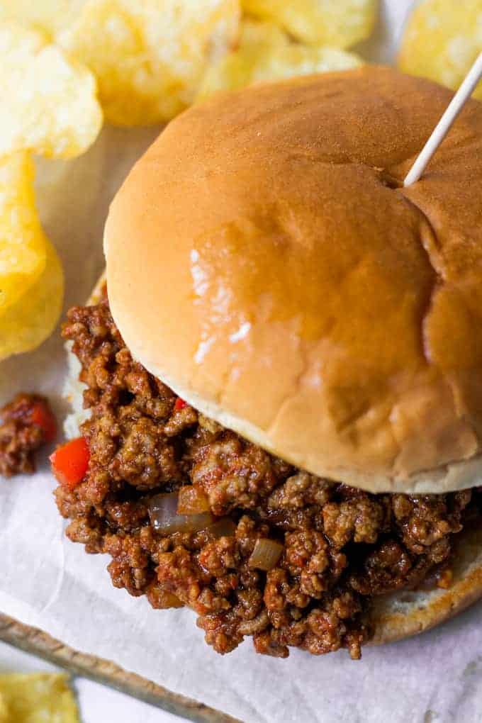 Toasted hamburger bun topped with ground beef coated in a sloppy Joe sauce. 