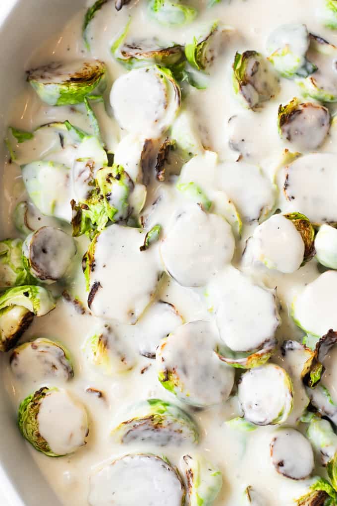 Cream sauce poured over Roasted Brussels sprouts.