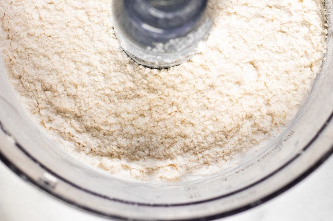 Texture of flour and butter combined in a food processor for making pie crust.