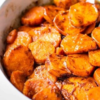 Baking dish filled with candied sweet potatoes.