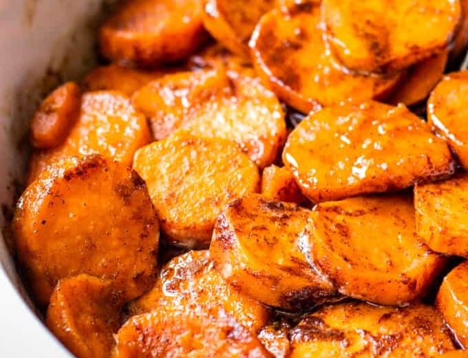 Baking dish filled with candied sweet potatoes.