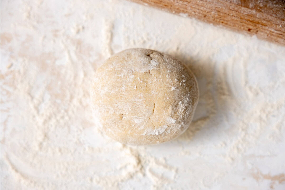 Pie crust on a floured surface ready to roll out. 