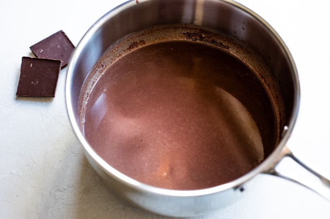 Homemade Mexican Hot Chocolate in a saucepan, showing it's smooth and silky texture. 