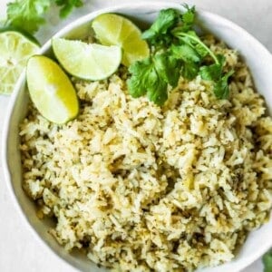Overhead shot of white bowl filled with green rice.