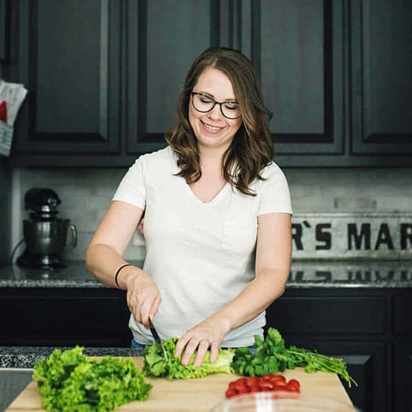 Headshot of Serene Herrera cooking in kitchen.