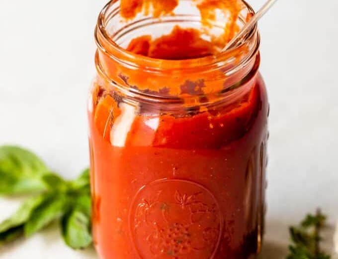 Jar filled with homemade pizza sauce