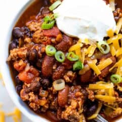Serving of turkey chili in a white bowl.
