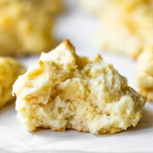 Buttermilk drop biscuit in half showing tender, soft baked bread on the inside.