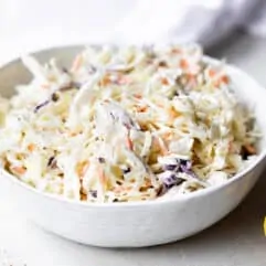 Bowl filled with creamy coleslaw.
