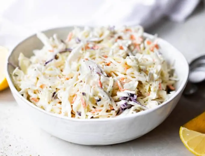 Bowl filled with creamy coleslaw.