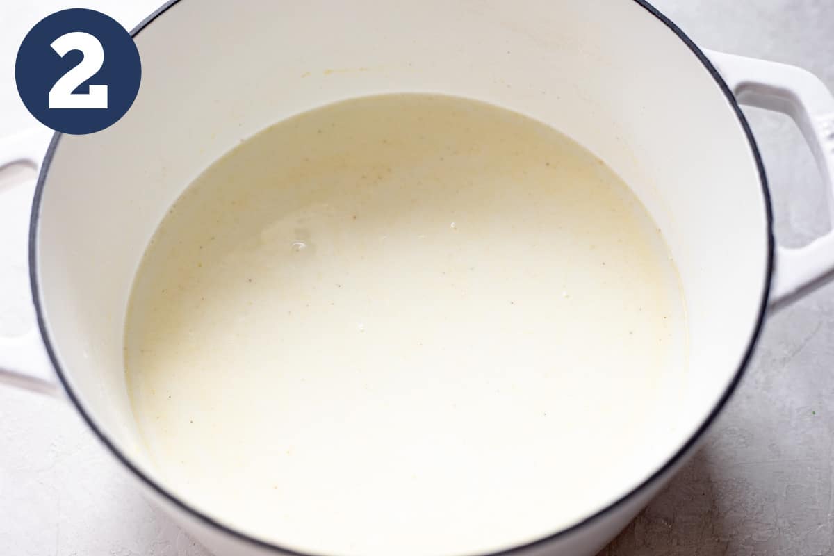 Milk added to roux to create a creamy sauce.