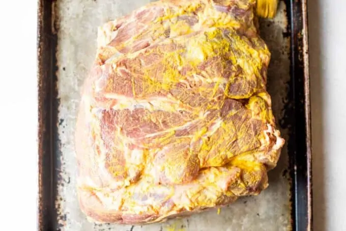 Pork shoulder smothered in mustard for a binder.