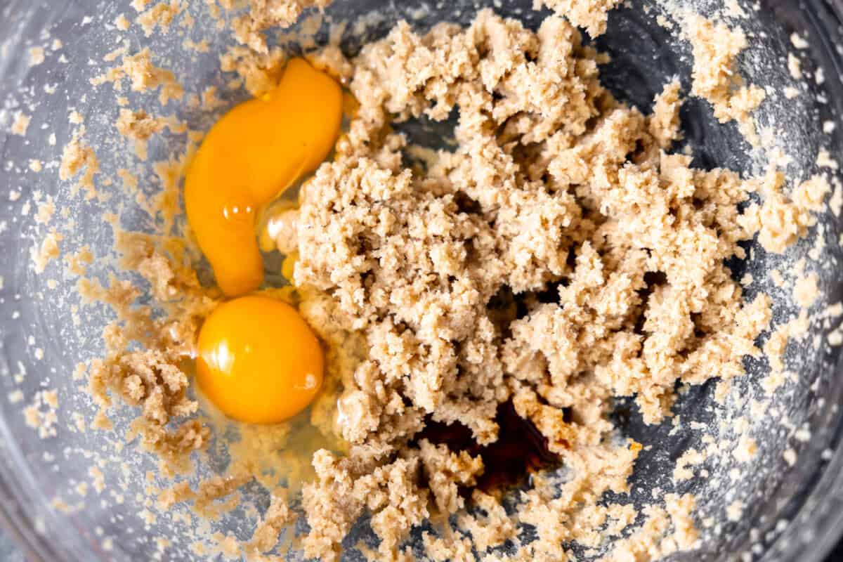 Creamed butter and sugar with eggs and vanilla be added to a glass mixing bowl. 