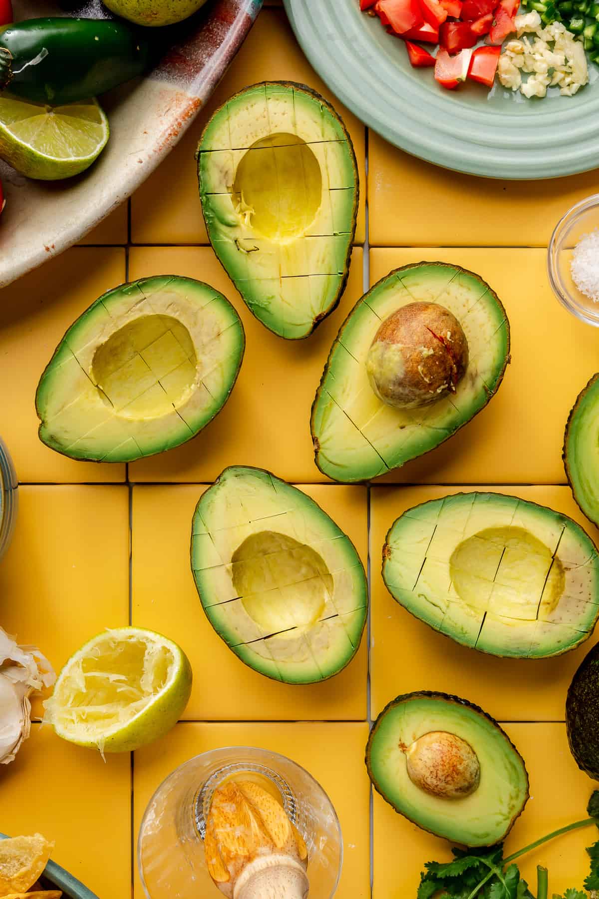 Halved avocados diced in the peel still.