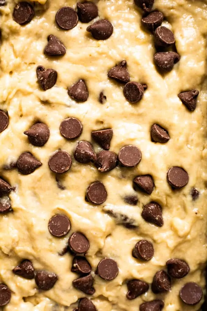 Close up view of banana bread batter with chocolate chips on top.