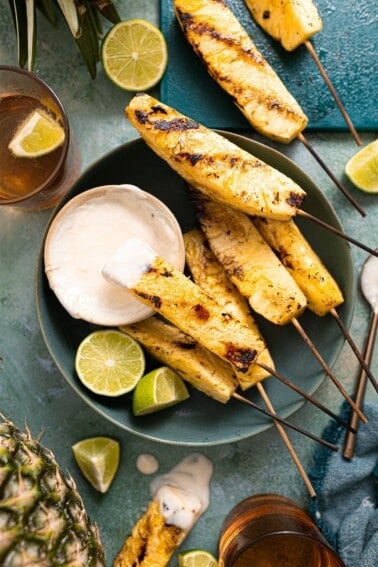 Grilled pineapple served with a coconut rum sauce.