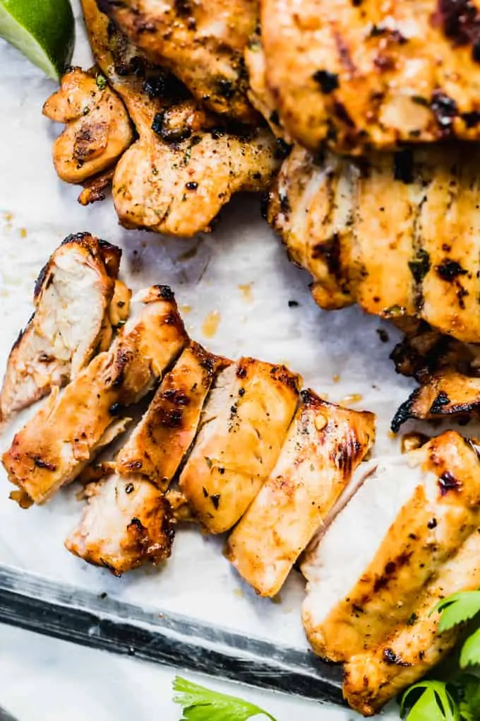 Grilled chicken breast that has been sliced.