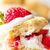 Strawberry shortcake made with a buttermilk biscuit, cut in half, layered with whipped cream and diced strawberries.