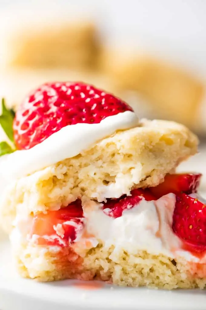 Strawberry shortcake made with a buttermilk biscuit, cut in half, layered with whipped cream and diced strawberries.