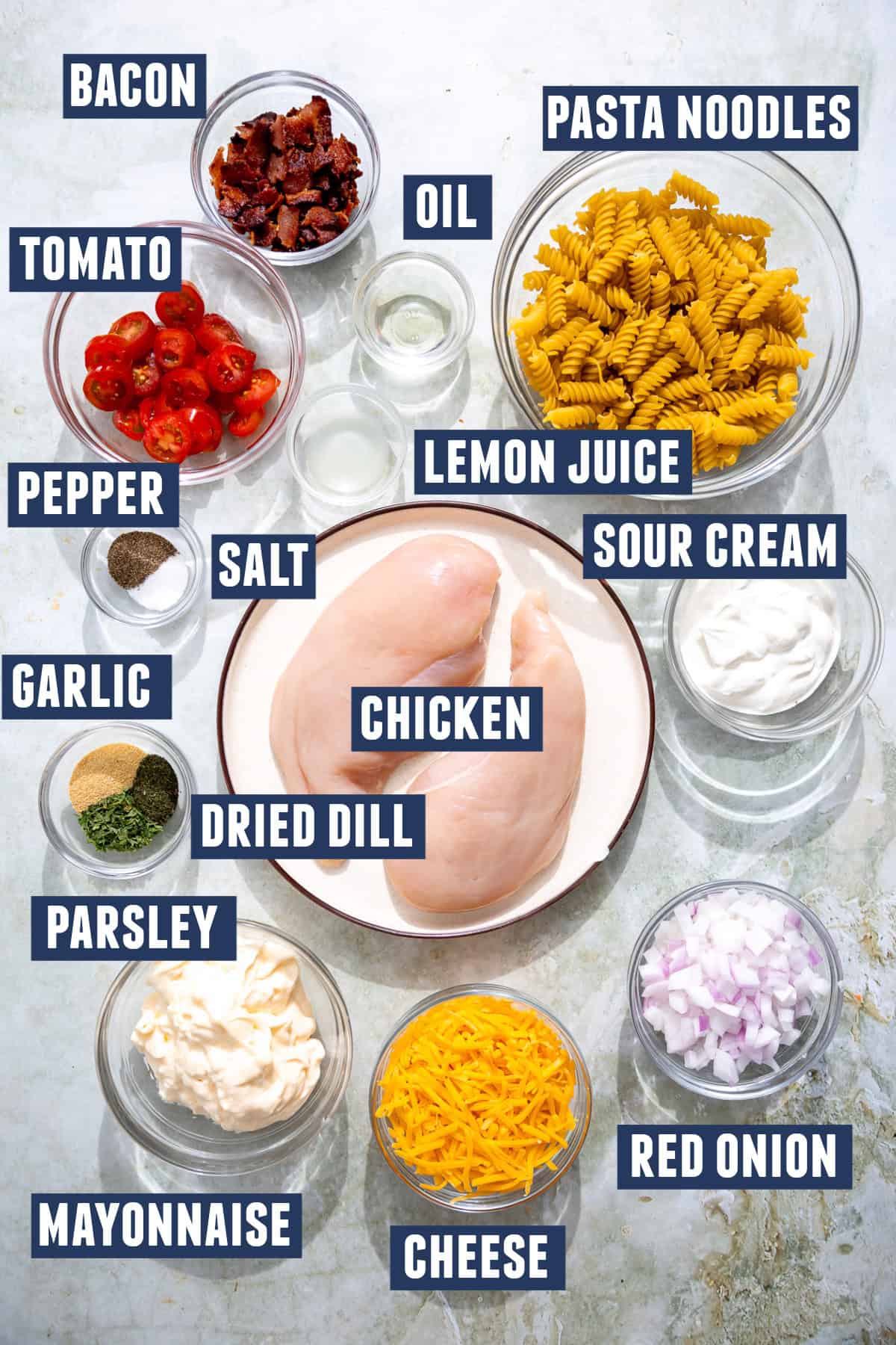 Ingredients needed to make chicken bacon ranch pasta salad. 
