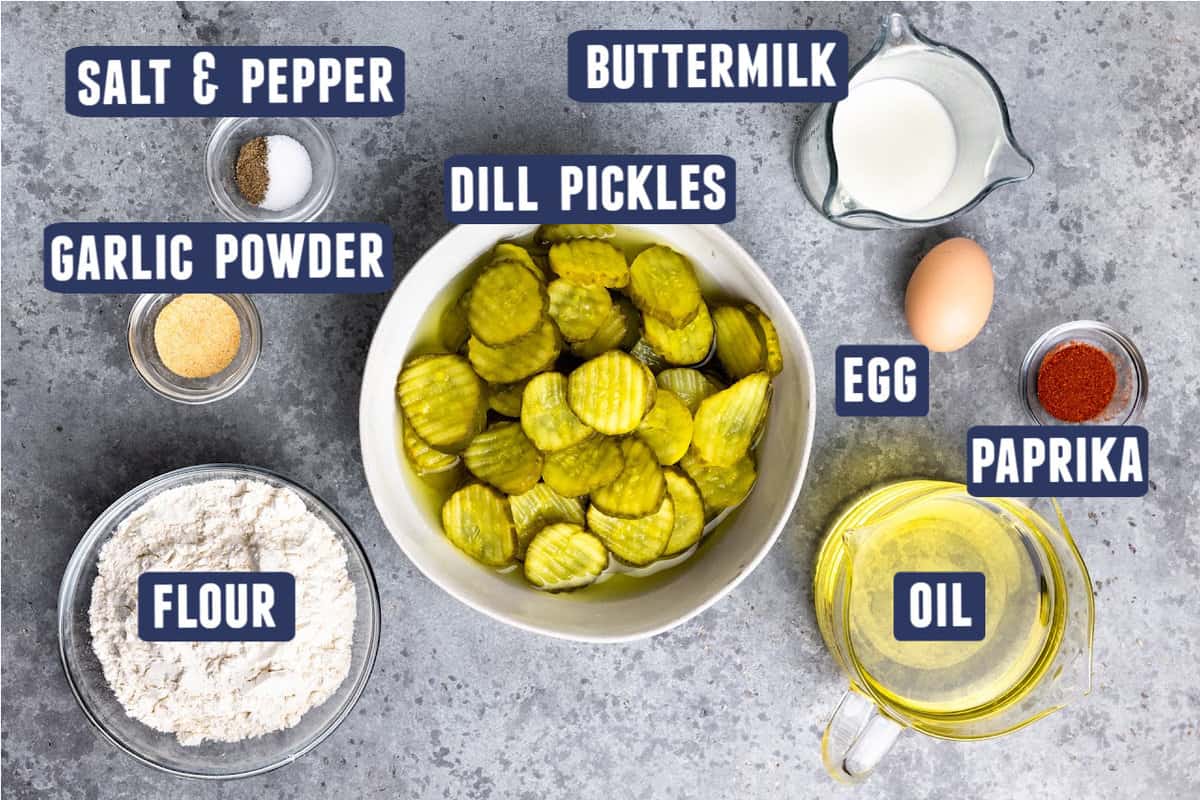 A bowl of dill pickle chips and ingredients needed to make batter for frying. 