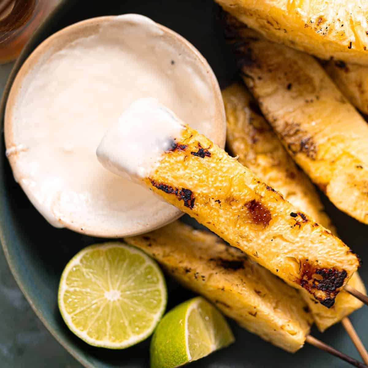 Grilled pineapple with coconut cream sauce.