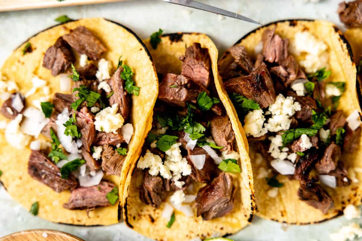 Carne Asada tacos with cilantro, onion and cotija cheese. 