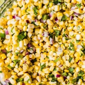Glass bowl filled with chipotle copy cat corn salsa.