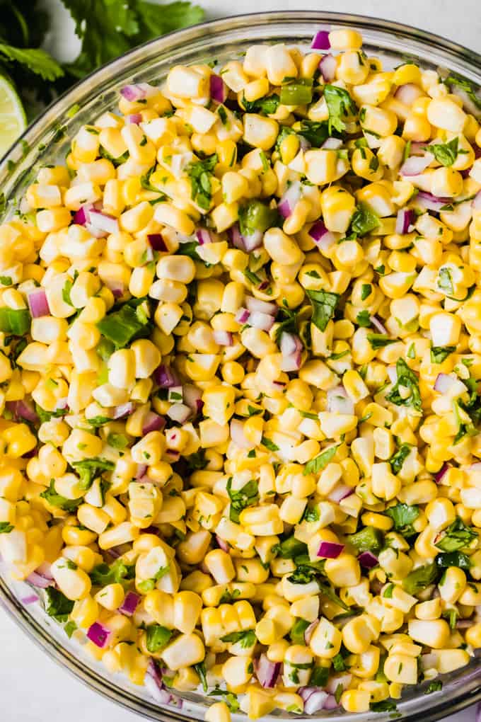Glass bowl filled with chipotle copy cat corn salsa.