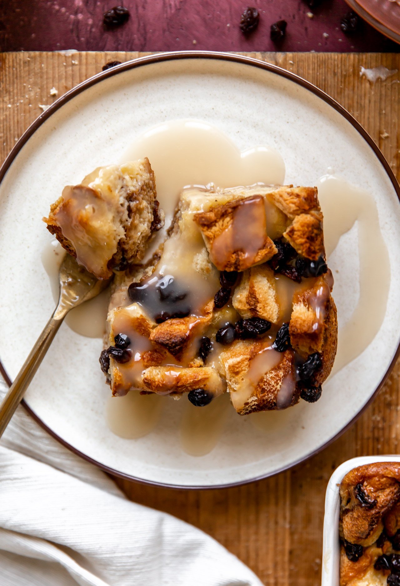 Overhead view of a plate with a serving of bread pudding.