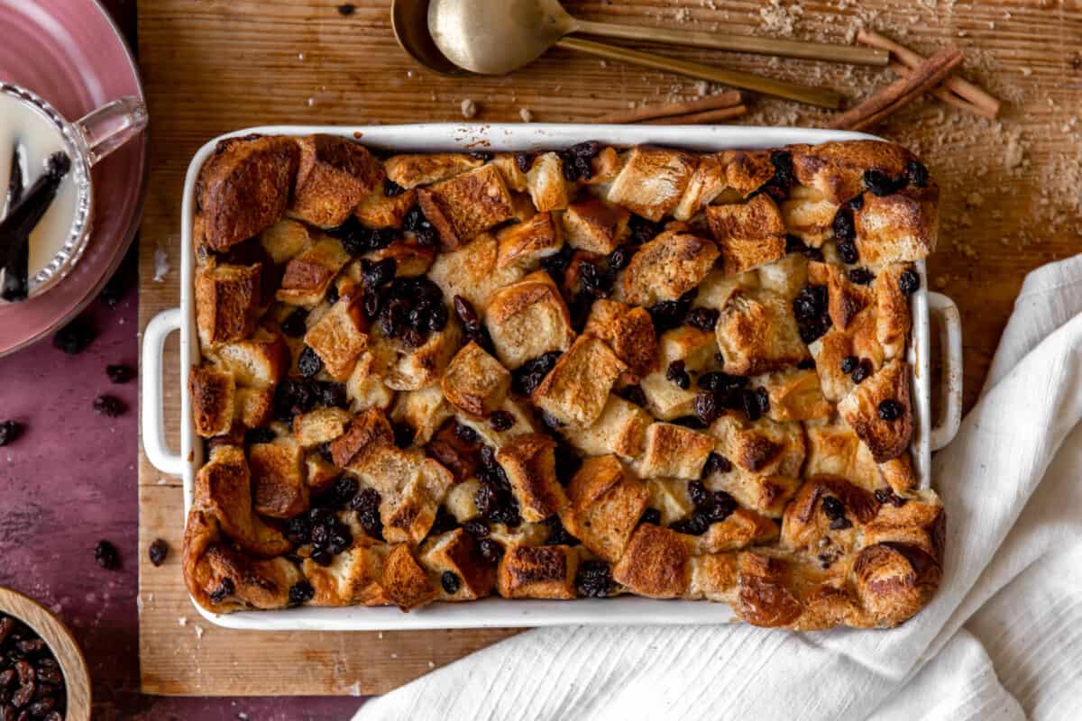 Baked bread pudding in a white dish. 