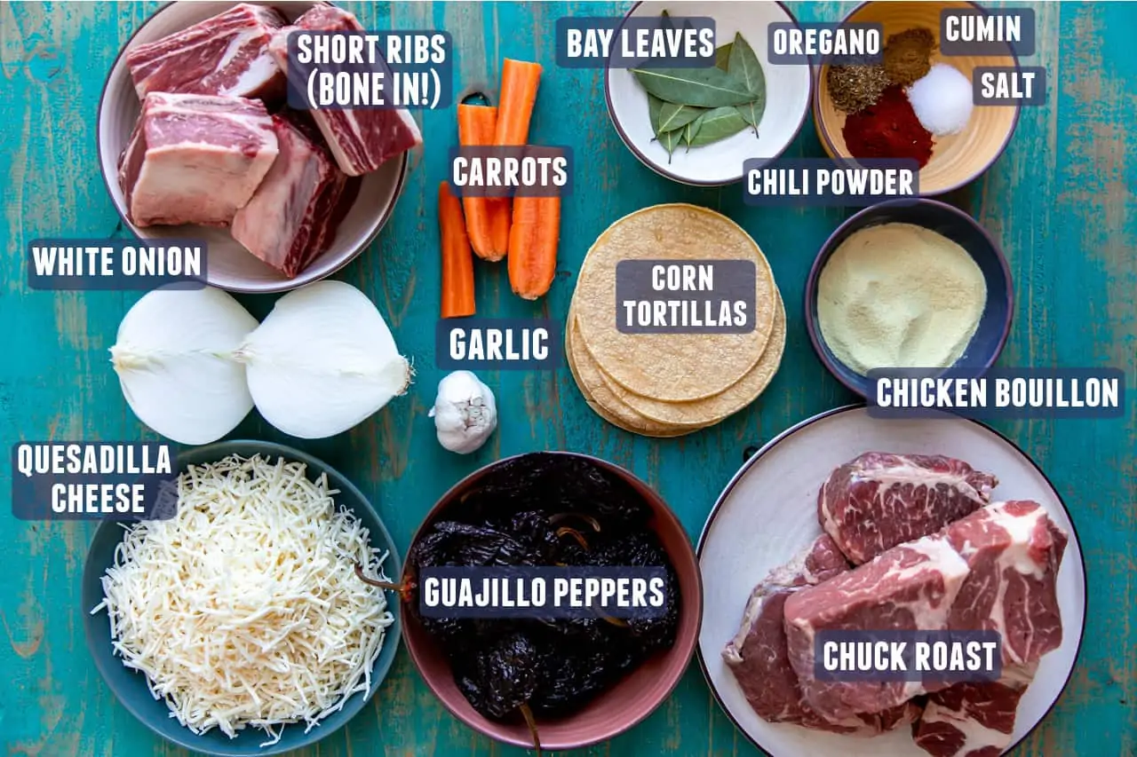 Ingredients laid out that are needed to make homemade birria and quesatacos at home. 