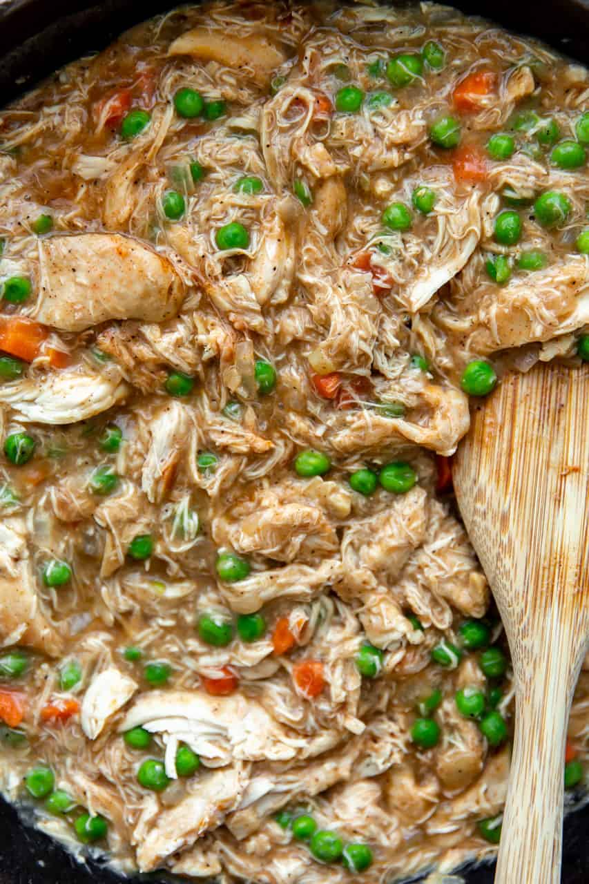 Up close view of pot pie filling with shredded chicken.