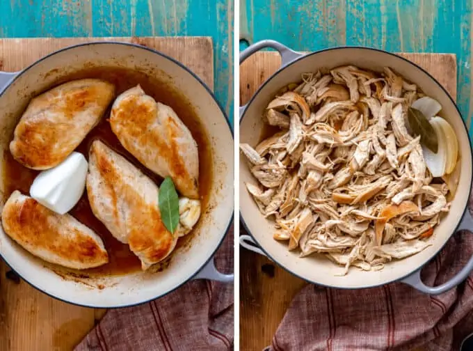 Chicken in a stock pot being cooked and shredded.