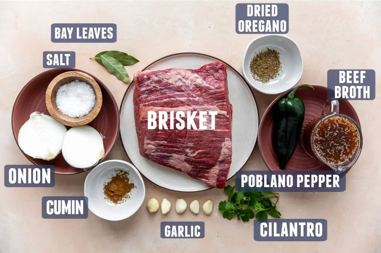 Ingredients needed for making brisket tacos laid out on counter.