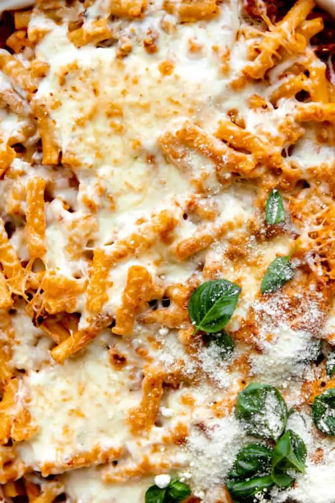 Up close view of baked ziti fresh from the oven after being baked and cheese is melted. 