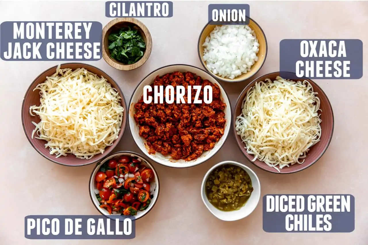 Ingredients needed for queso fundido laid out on a counter.