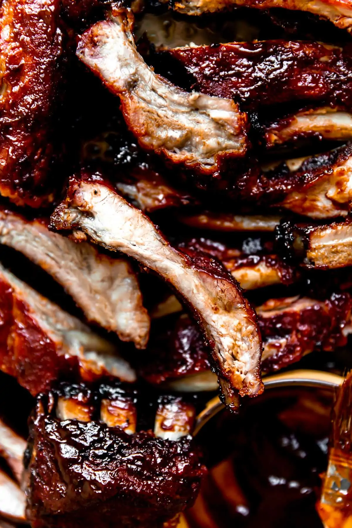 Sliced pork ribs that have been smoked all stacked and ready to serve.