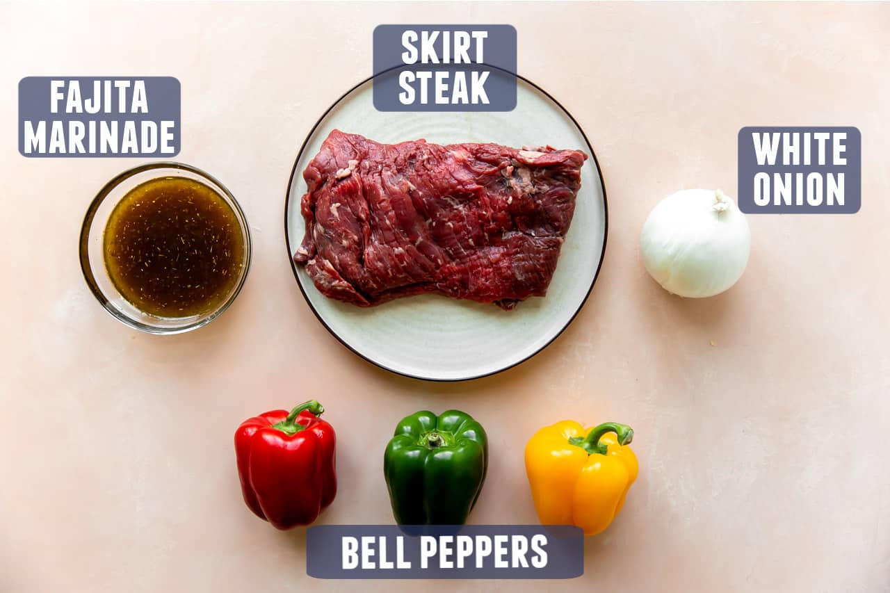 Ingredients for steak fajitas laid out on a counter.