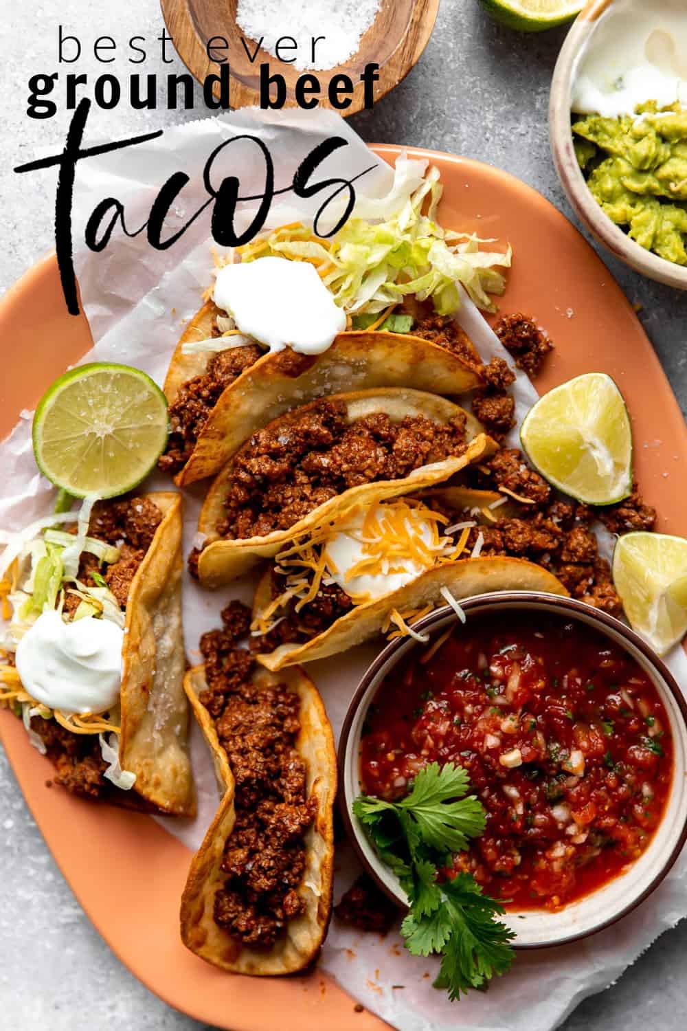 Ground beef tacos on a plate served with salsa.