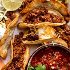 Homemade ground beef taco meat loaded into fried corn tortillas.