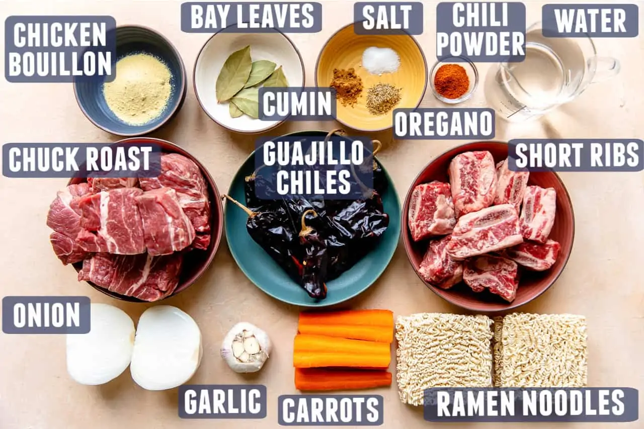 Ingredients needed to make homemade birria laid out on a counter.