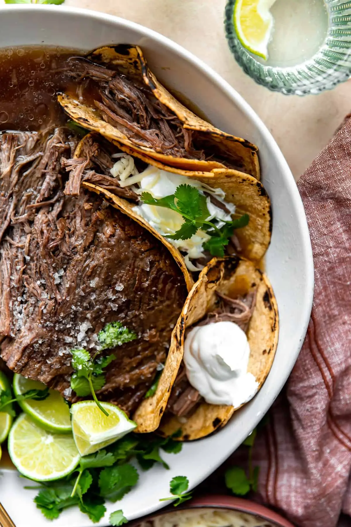 Bowl filled with shredded brisket meat for tacos. 