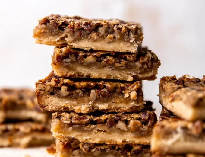 Stack of homemade pecan pie bars.